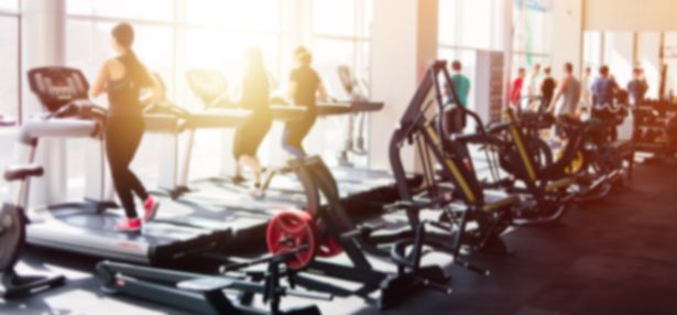 0_Blurred-photo-of-a-gym-with-people-on-treadmills.jpg